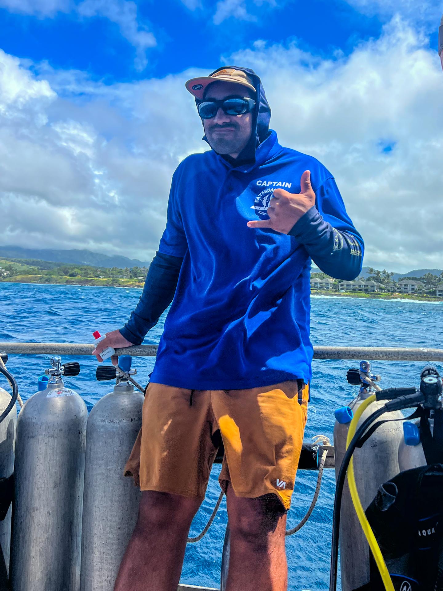 a man standing next to a body of water